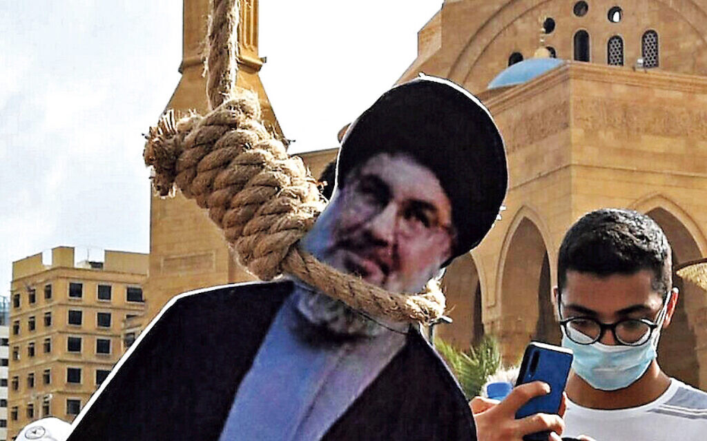 A picture shows noose with the portrait of Hassan Nasrallah, the head of Lebanon's Shiite Muslim movement Hezbollah, hung by Lebanese protesters in downtown Beirut