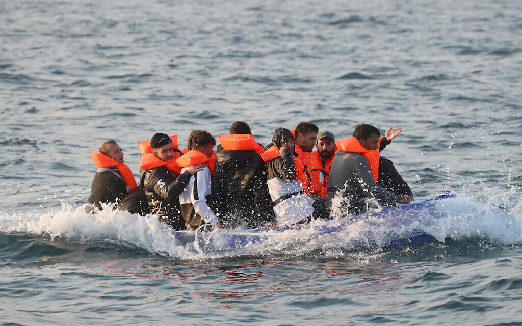 A group of people thought to be migrants crossing the Channel in a small boat headed in the direction of Dover, Kent. (Gareth Fuller/PA Wire)