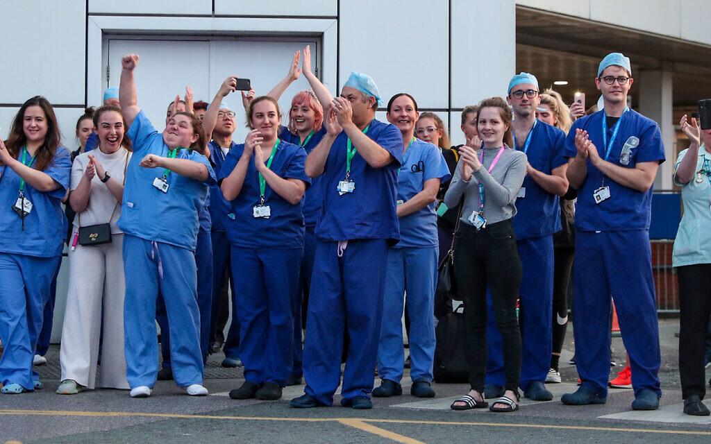 NHS workers come outside during nationwide Clap for Carers NHS initiative