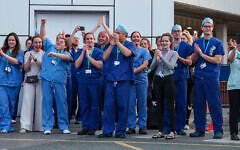 NHS workers come outside during nationwide Clap for Carers NHS initiative