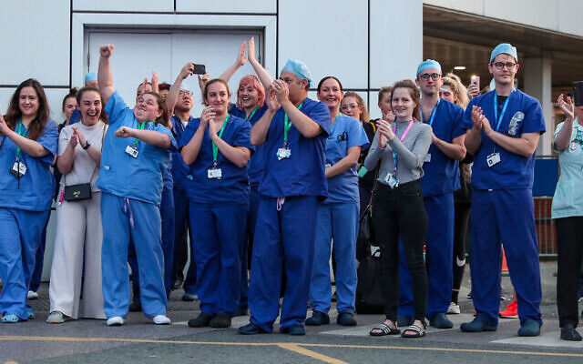 NHS workers come outside during nationwide Clap for Carers NHS initiative