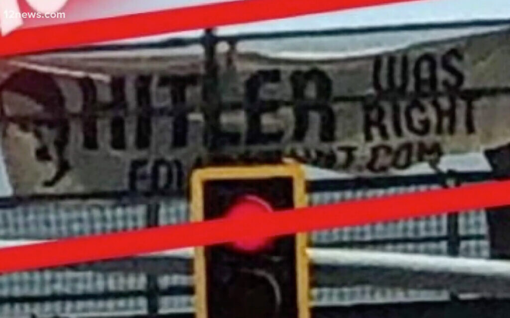 A banner reading "Hitler was right" on a bridge in Arizona. (Screenshot/KPNX 12News via Times of Israel )