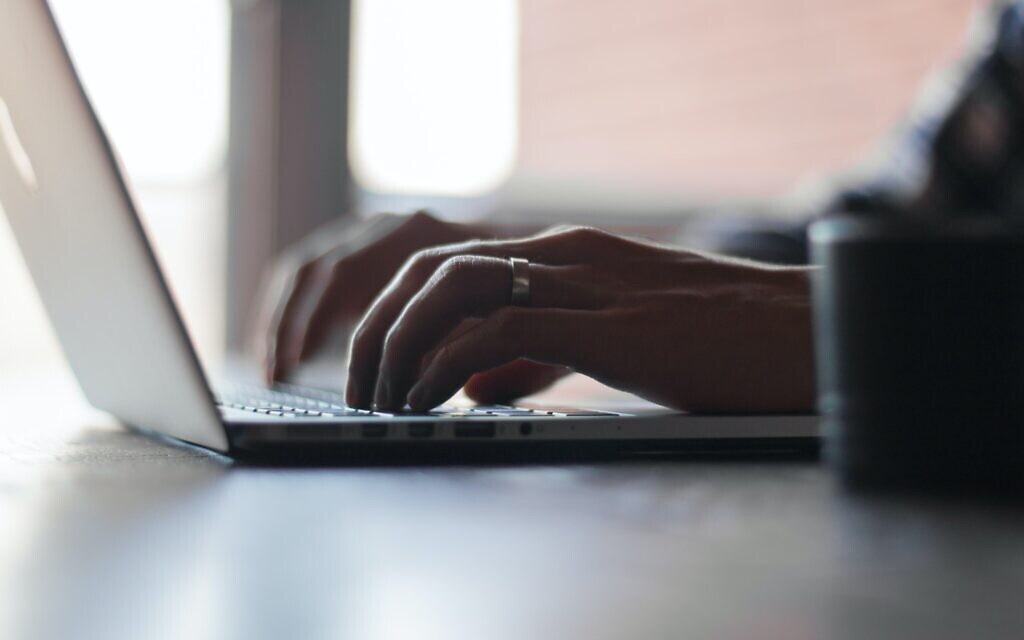 Stock image of a person using a laptop. (Credit: Thomas Lefebvre on Unsplash)