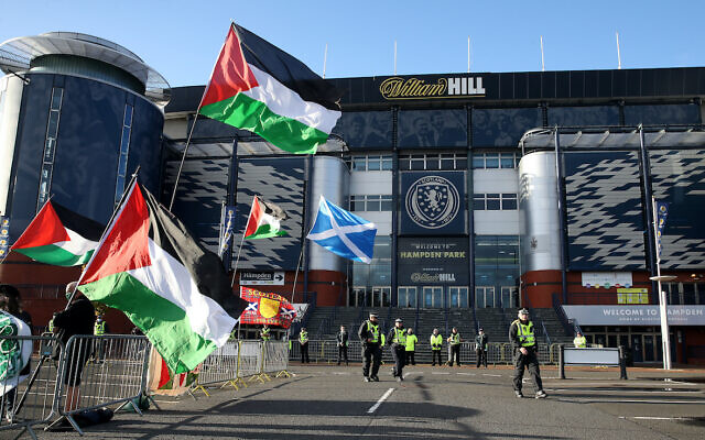 Protesters wave Palestinian flags outside the ground before the UEFA Nations League Group F match at Hampden Park, Glasgow in September. (PA Wire/Andrew Milligan)