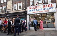 The Duke and Duchess of Cambridge leave after a visit to the Beigel Bake Brick Lane Bakery in London.