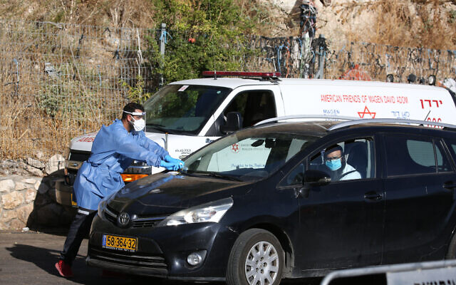 Israeli medical personnel take samples in the northern city of Tzfat.