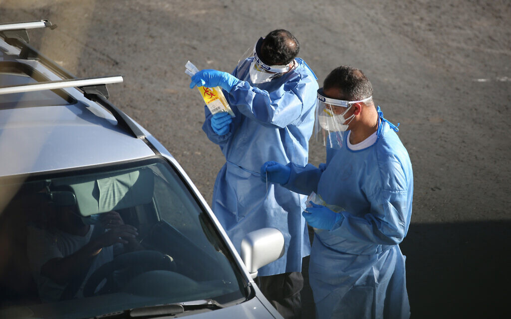 Israeli medical personnel take samples at a drive through COVID-19 testing facility in the northern city of Tzfat, on September, 29 2020. Israel has registered more than 234,060 coronavirus cases with 1,516 deaths, out of a population of nine million. Photo by: David Cohen-JINIPIX