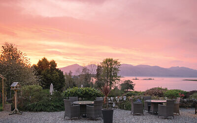 A pink sunset viewed from the terrace at Airds Hotel