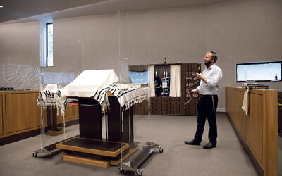 Anti-virus screens around the bimah at South Hampstead synagogue