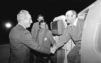 Then Israeli Prime Minister Shimon Peres welcomes Natan Sharansky as he lands in Israel straight from his release in 1986 