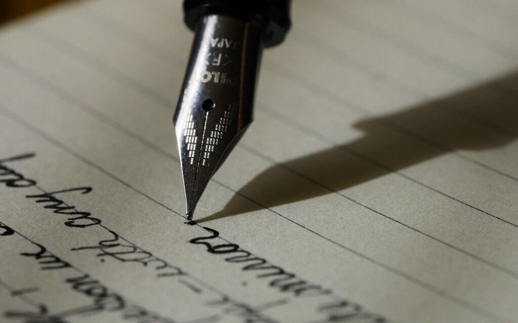 Writing to a Pen Pal (Photo by Aaron Burden on Unsplash)