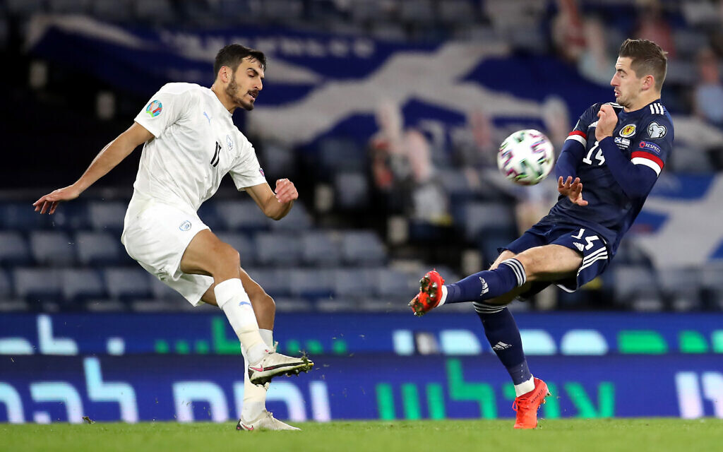 Israel's Manor Solomon kicks the ball towards Scotland's Kenneth McClean during the UEFA Euro 2020 Play-Off semi final match at Hampden Park, Glasgow. (PA Wire/PA Images)