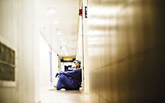 An exhausted staff member at Haifa’s Bnai Zion Medical Center