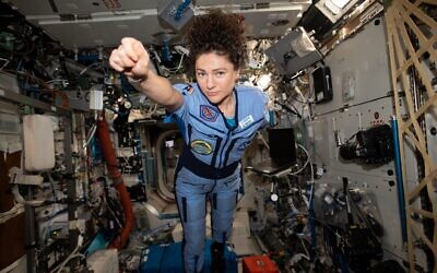 Jessica Meir strikes a superhero pose while on board the International Space Station. Credit: NASA