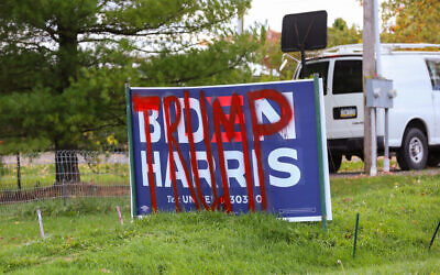 A defaced Biden-Harris sign is spray-painted with the word "Trump" near Centre Hall, Pennsylvania on October 24, 2020. (Photo by Paul Weaver/Sipa USA)