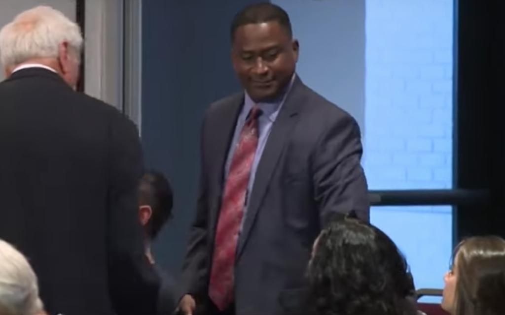 William Latson was fired for saying "can't say the Holocaust is a factual, historical event." (Screenshot from YouTube)