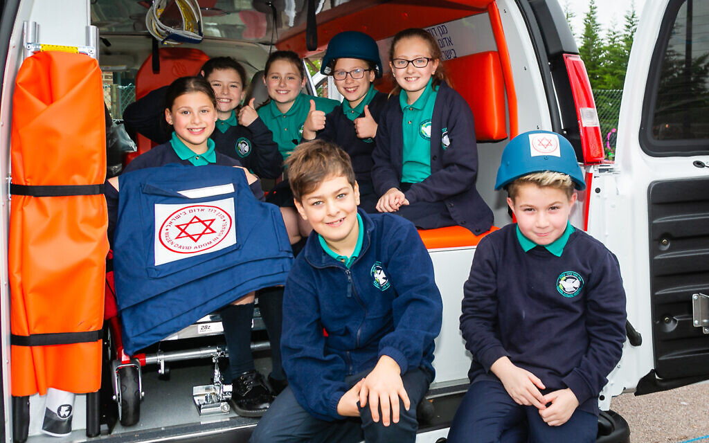 Students with the MDA ambulance at Clore Shalom (Credit: Yakir Zur)
