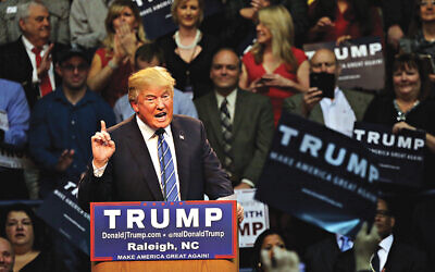 Republican presidential candidate Donald Trump speaks at Dorton Arena in Raleigh, N.C., Friday, Dec. 4, 2015. (AP Photo/Ted Richardson)