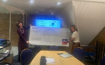 Chairman Louise Hager and Chief Executive Lisa Steele presenting the  community-raised cheque exceeding an £3m