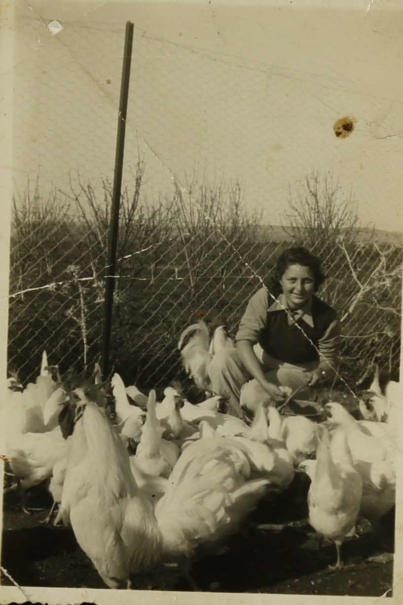 Hannah Senesh with chickens on Moshav Nahalal