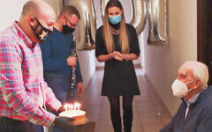 Jonny Daniels delivers Jozef Walaszczyk, right, a cake on his 101st birthday in Warsaw, Poland on Nov. 12, 2020. (From the Depths)
