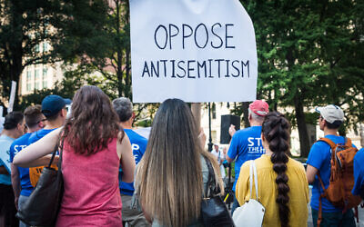 Protesters with a sign opposing antisemitism  (Photo by Gabriele Holtermann-Gorden/Sipa)