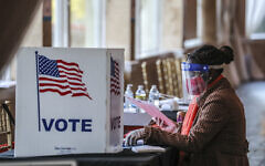 Atlanta: A poll worker sorts through voting material at Park Tavern in Atlanta on Tuesday, November 3, 2020. Voters lined up outside polling places Tuesday morning to be among the first to cast their votes on a crucial Election Day. Photo by John Spink/Atlanta Journal-Constitution/TNS/ABACAPRESS.COM Atlanta: A poll worker sorts through voting material at Park Tavern in Atlanta on Tuesday, November 3, 2020. Voters lined up outside polling places Tuesday morning to be among the first to cast their votes on a crucial Election Day. Photo by John Spink/Atlanta Journal-Constitution/TNS/ABACAPRESS.COM