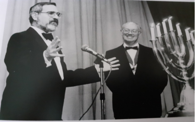 Induction of  Rabbi  Sacks to membership of the Lodge with Gerald Kirsh President of First Lodge at the time.
