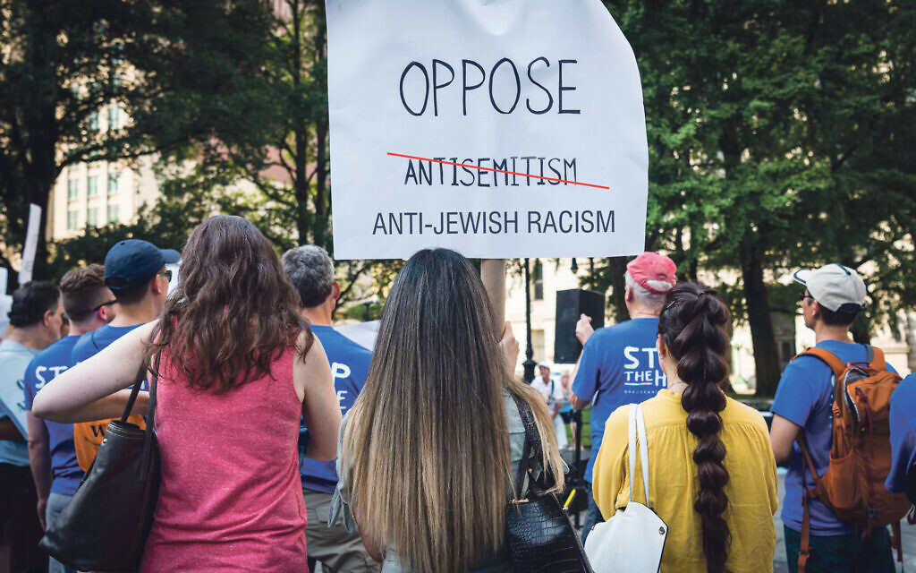 Protesters with a sign opposing antisemitism - but are more now using a different term?  (Photo by Gabriele Holtermann-Gorden/Sipa)
