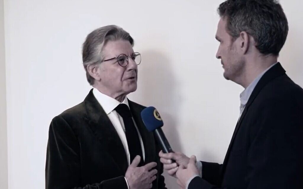 Geoffrey Hoguet (L), a descendent of the Rothschild family, is interviewed on February 25, 2020 (Screen grab/YouTube via Times of Israel)
