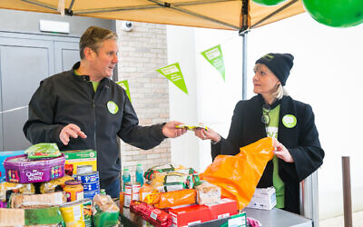 Keir Starmer at South Hampstead Synagogue with Mitzvah Day founder Laura Marks, sorting through items which will be donated to charity. (Credit: Yakir Zur)