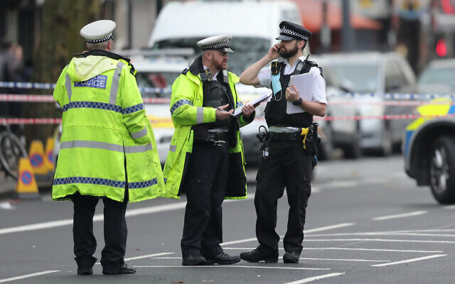 Police at the scene of an incident in Stamford Hill in north London where a car is reported to have mounted the pavement and struck a number of pedestrians.