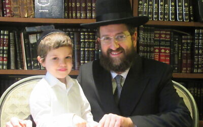 Dayan Dovid Engalnder with his 4-and-a-half year-old son, Shimon