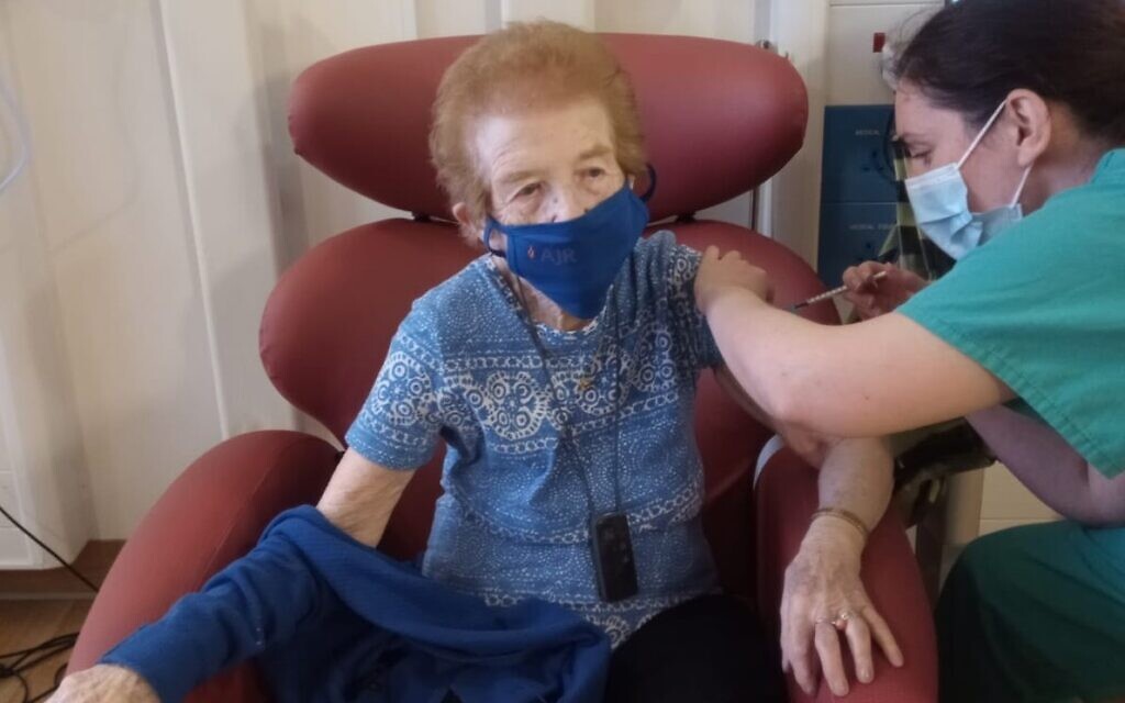 Eve getting the jab at the Royal Free! She said it 'is giving us life', urging others to get it when possible (Holocaust Educational Trust)