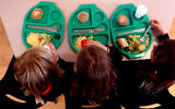 Picture of pupils enjoying school dinners.