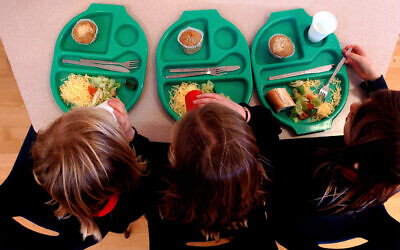 Picture of pupils enjoying school dinners at a Primary School.