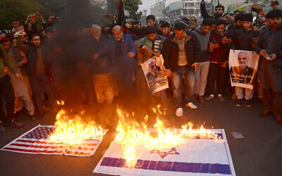 Shiite Muslims of Imamia Students Organization (ISO) hold a protest rally & burn representations of US and Israeli flags during protest against U.S. after the killing of the powerful commander of Irans Islamic Revolutionary Guards Corps, Maj. Gen. Qassim Suleimani, in a drone strike on Friday, in Lahore, Pakistan on January 3, 2020. Iran has vowed "harsh retaliation" for the U.S. airstrike near Baghdad's airport that killed Tehran's top general and the architect of its interventions across the Middle East, as tensions soared in the wake of the targeted killing. (Photo by Rana Sajid Hussain / Pacific Press/Sipa USA)