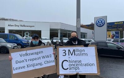 A demonstrator outside Volkswagen showroom, Southgate, London, protesting the company’s presence in the Uyghur region of China and its use of Uyghur forced labour.