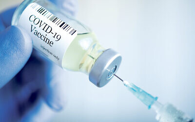 Covid-19 vaccine administered through an injection