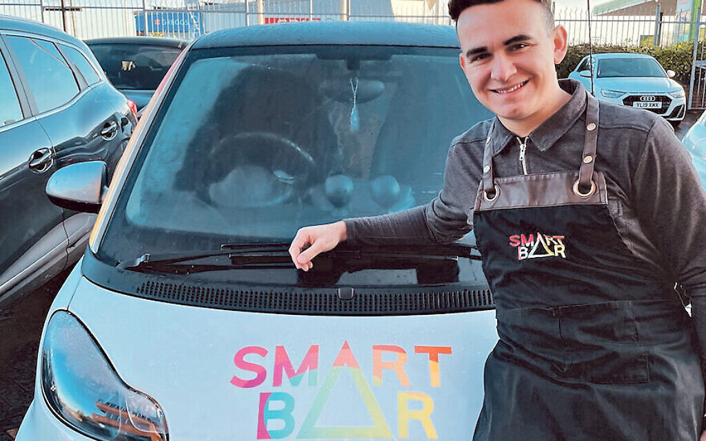 Ben Morrison with his Smart car, the back of which he has converted into a coffee bar