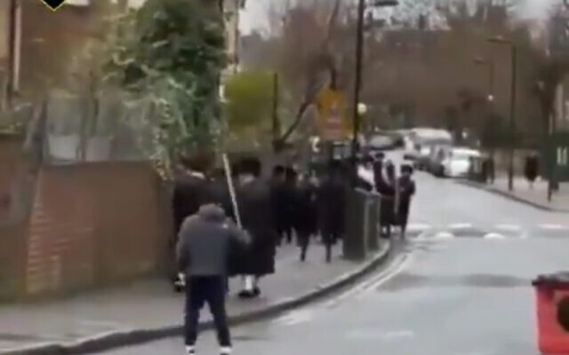 Screenshot from Shromrim's video of the man targeting Charedi Jews on their way to synagogue