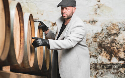 Danny Saltman, of DS Taymans whisky, inspecting a cask in the company warehouse
