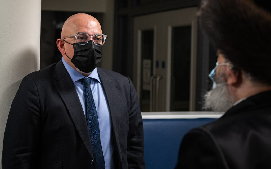 Nadhim Zahawi speaking to a member of the strictly-Orthodox community at the mass vaccination event