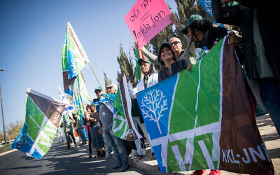 KKL-JNF Workers holding signs and flags during a protest outside the Prime Minister's Office in Jerusalem,