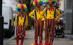 Orthodox Jewish children dressed as clowns celebrate the festival of Purim in Stamford Hill in north London. Orthodox Jewish children dressed as clowns celebrate the festival of Purim in Stamford Hill in north London.