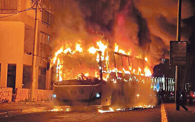 Bus torched by Orthodox lockdown rioters
