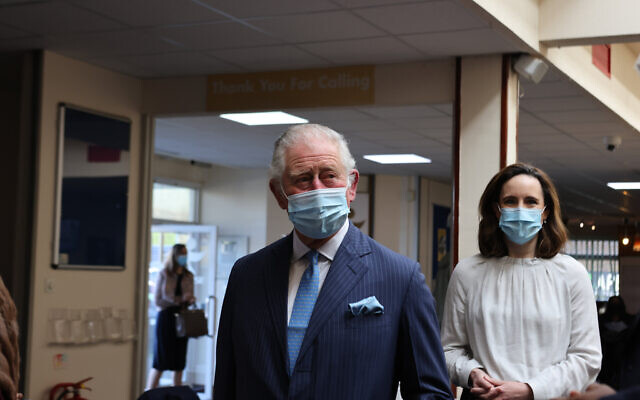 The Prince of Wales arrives for a visit to an NHS vaccine pop-up clinic at Jesus House church, London. Here he is pictured with Dr Charlotte Benjamin