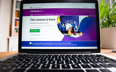 The Census 2021 start screen is displayed on a laptop screen. The Census 2021 start screen is displayed on a laptop screen.