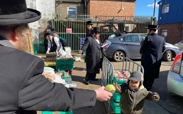 Jewish Community Council of North London photo of Jewish volunteers distributing hundreds of food packages to families ahead of Passover.
