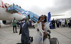 Ethiopian olim pray on the tarmac after their flight landed (Photo: Olivier Fitoussi) Ethiopian olim pray on the tarmac after their flight landed (Photo: Olivier Fitoussi)